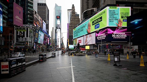 A public health service announcement notice is displayed at New York's Times Square.