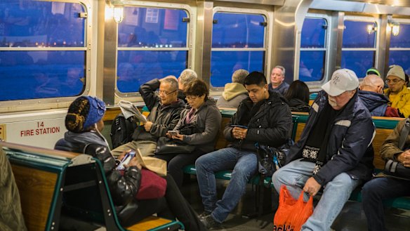 Commuters ride the Staten Island Ferry into Manhattan.