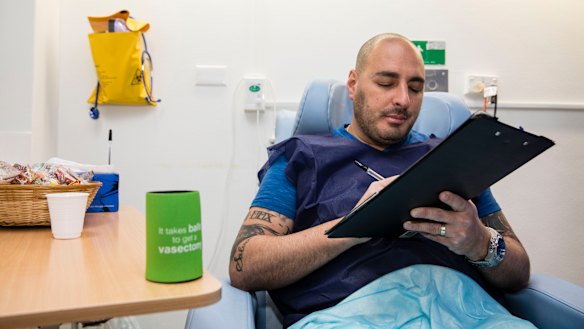 Alex Giraldo, 37, sits in the recovery room after getting a vasectomy at Marie Stopes in Westmead in Sydney. 