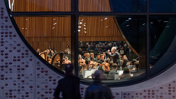 'Portholes' in the Melbourne Conservatorium of Music allow passers-by to peer in and observe a performance.