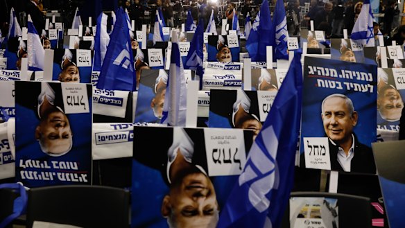 Election campaign posters show Israeli Prime Minister Benjamin Netanyahu at his party's headquarters before the election results are announced in Tel Aviv, Israel.