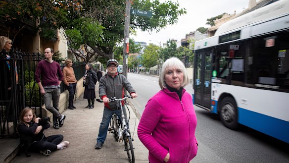 Glebe resident Di Anstey (front) and her neighbours say a pop-up cycleway on Bridge Road will make life more difficult for them.