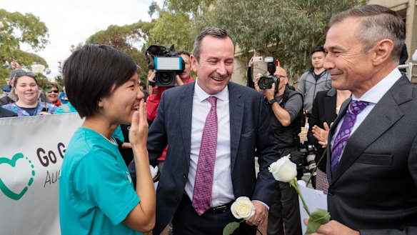 Belinda Teh is greeted by Premier Mark McGowan and Health Minister Roger Cook outside WA Parliament House. The 27-year-old Perth woman embarked on a 4500km journey from Melbourne to Perth after watching her mother die from breast cancer in 2016.