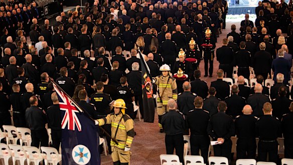 Members of the Queensland Fire and Rescue Service mourn Izabella Nash.