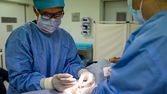 Dr Justin Low performing a vasectomy. 