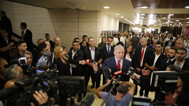 Israeli Prime Minister Benjamin Netanyahu speaks to the media after the vote.