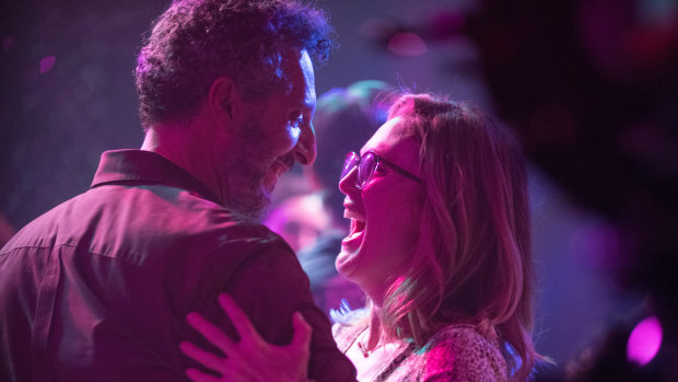 Julianne Moore dances with Arnold, an adventure park owner played by John Turturro in Gloria Bell.