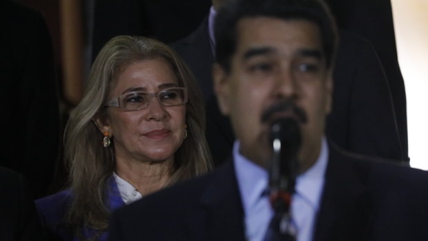 With first lady Cilia Flores in the background, Venezuela's President Nicolas Maduro speaks to the press last week.