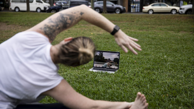 Sydney Yoga Collective founder Casey Castro teaches 15-year-old Charlotte via Zoom.