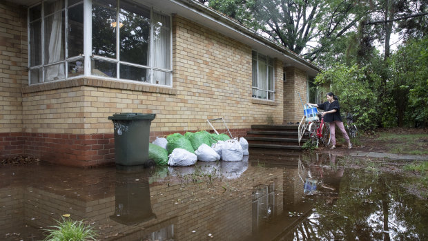 Mary Vu's front yard in O'Connor was flooded.