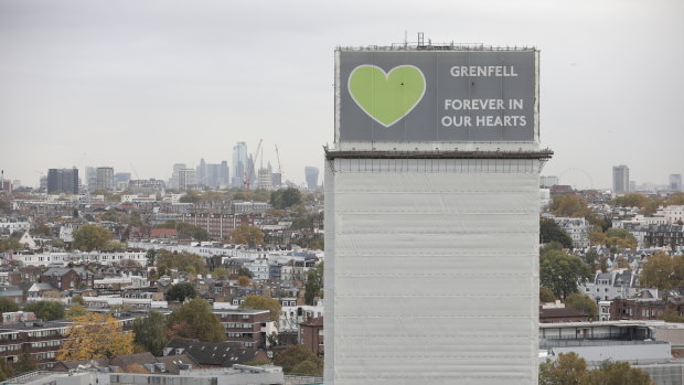 A general view of what remains of Grenfell Tower covered with hoardings following a severe fire in June 2017 in London, England. 