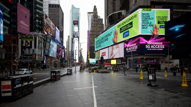 A public health service announcement notice is displayed at New York's Times Square.