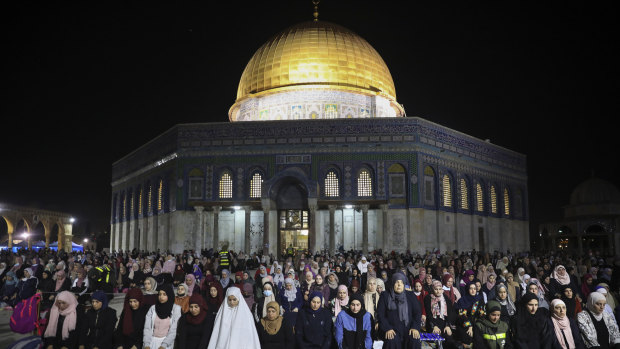 Palestinian Muslim worshippers pray during Laylat al-Qadr, or the night of destiny, in the holy fasting month of Ramadan, in front of the Dome of the Rock at the al-Aqsa Mosque compound in Jerusalem’s Old City. 