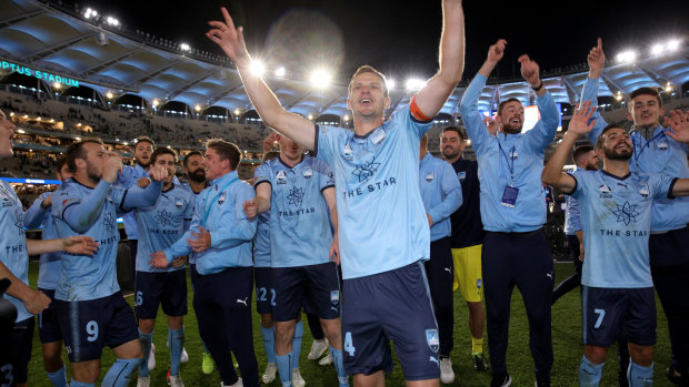 Sydney FC celebrate winning the A-League title on Sunday night. 