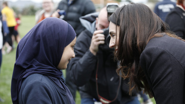 Prime Minister Jacinda Ardern greets students on Friday.