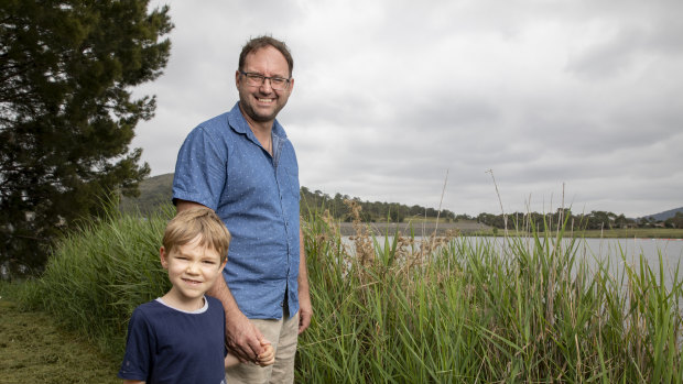 Ross Thompson, a University of Canberra researcher, is conducting ACT government-backed research at Lake Tuggeranong to determine why it gets frequent algae outbreaks. He is pictured here with his son Zac.