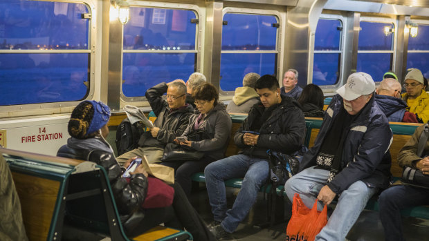 Commuters ride the Staten Island Ferry into Manhattan.