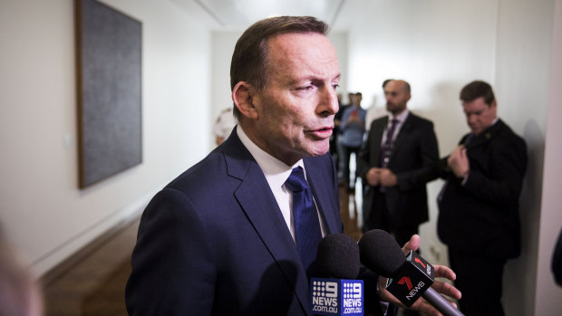 Tony Abbott leaves they party room after Friday's leadership spill.