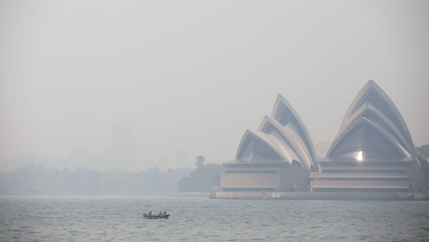 Smoke haze from nearby bushfires as seen on Sydney Harbour from Kirribilli in Sydney on December 19, 2019.