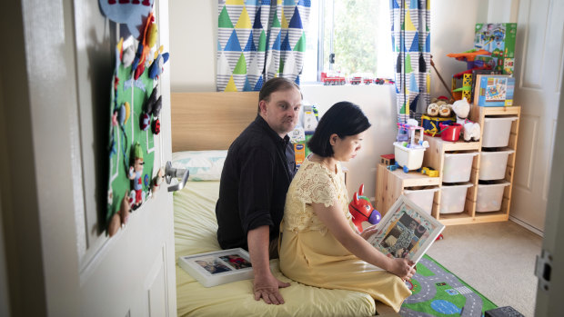 Thomas and Tran Wheeler in their son Patrick's room. Patrick is unable to return home from Vietnam due to COVID-19.