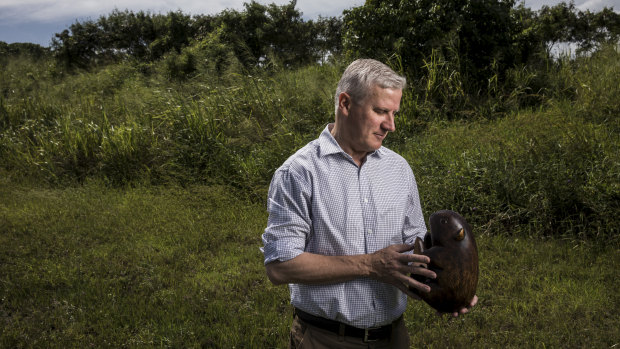 Nationals leader Michael McCormack with the party's official wooden wombat, on the campaign trail in Mackay.