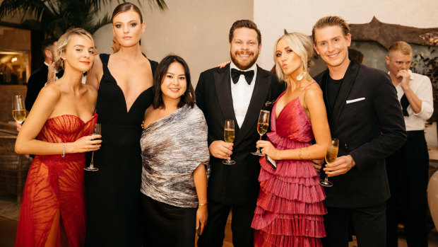 Nadia Fairfax, Montana Cox, Caroline Tran, Nick Pitt, Montarna Pitt and Elliot Garnaut raise a glass at the White Caravan gala.