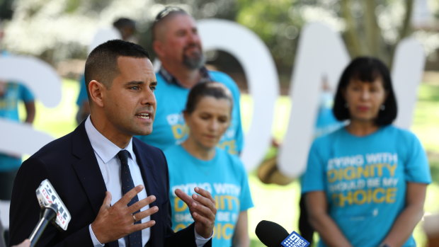 Sydney MP Alex Greenwich alongside members of Dying with Dignity speaks to the media after introducing his Voluntary Assisted Dying Bill into the Legislative Assembly on Thursday. 