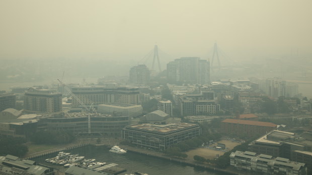 Smoke envelops the city after another day of bushfires on Thursday.