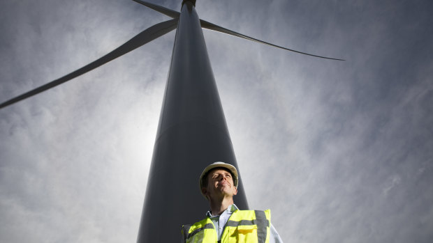 Minister for climate change and sustainability Shane Rattenbury at the opening of the Crookwell 2 wind farm in early November. The move to 100 per cent renewable electricity added $72 to the average power bill in 2017-18.