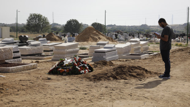 A man prays at the grave of Moshe Agadi, who was killed by a rocket fired from Gaza into the Israeli city of Ashkelon.