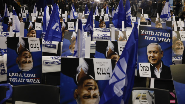 Election campaign posters show Israeli Prime Minister Benjamin Netanyahu at his party's headquarters before the election results are announced in Tel Aviv, Israel.