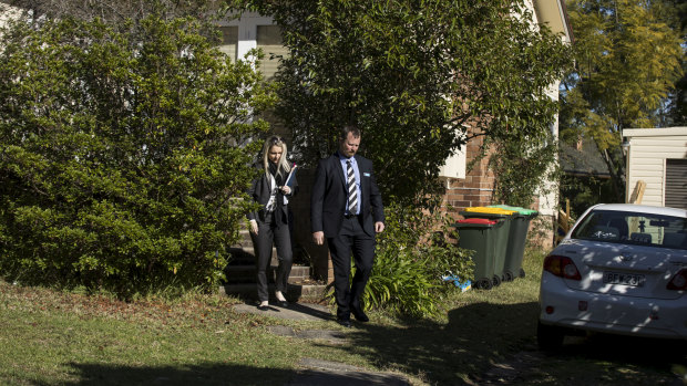 Detectives leave the house where Jack and Jennifer Edwards were murdered by their father, John Edwards, in 2018.  