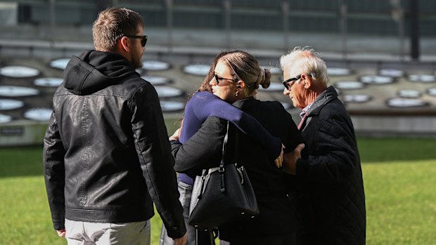 Victor White (right), husband of murder victim Vyleen White, with family and friends arriving at the Supreme Court.