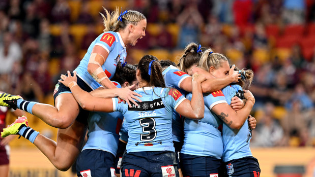 The Sky Blues celebrate after Emma Tonegato scores first.