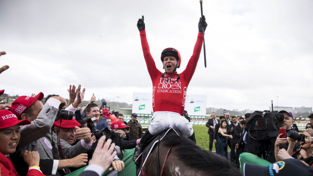 Jockey Kerrin McEvoy smiles after riding Redzel to win the TAB Everest horse race