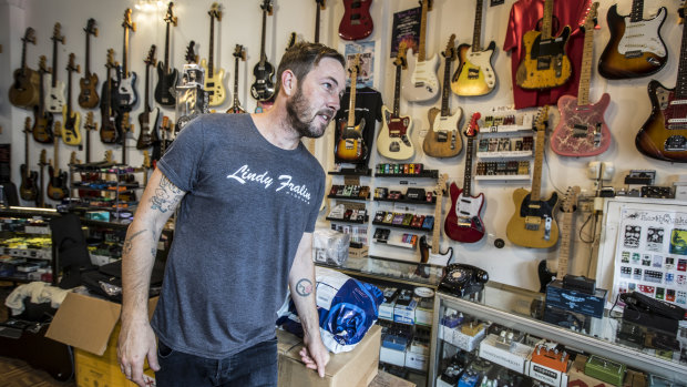 Nicholas Munning works at Global Vintage, a guitar shop on busy Parramatta Road in Annandale.