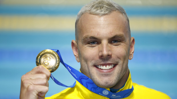 Kyle Chalmers shows off his gold medal after the men’s 100m freestyle final at the World Shortcourse Championships in Melbourne.