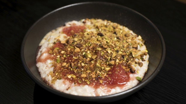 The porridge comes topped with pistachio, clotted cream, pear and rhubarb stew. 