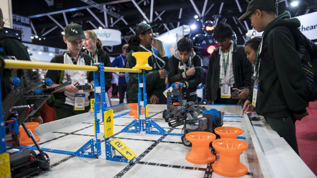 Students test out the robots at a Vex Robotics showcase at EduTECH on Thursday. 