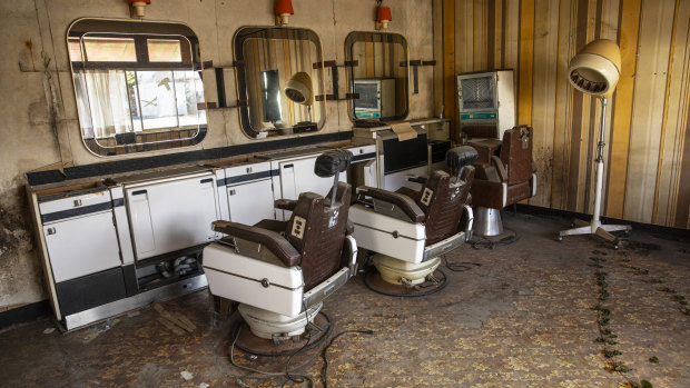 An abandoned hair salon in Namie. Despite government efforts, only a fraction of the town's residents have returned.