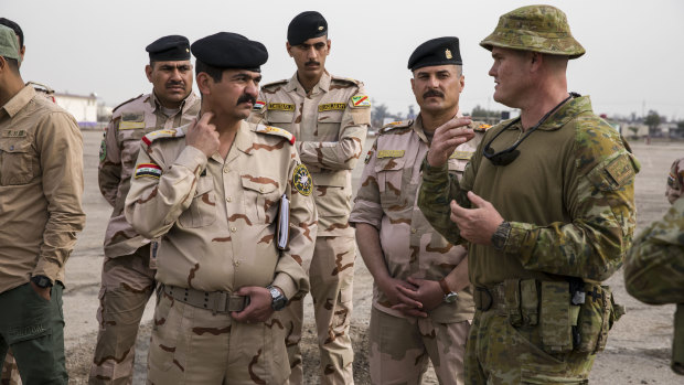 Steel instructs Iraqi Army soldiers a the Taji Military Complex in Baghdad, Iraq during his rotation with Task Group Taji 6. 