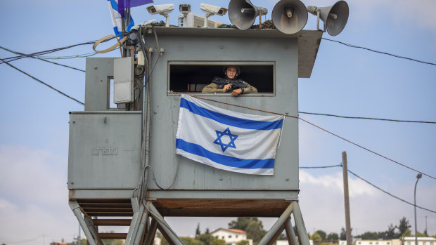 An Israeli soldier stands guard at the Tapuach junction next to the West Bank city of Nablus on Tuesday.