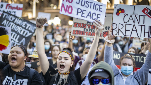 Protesters participate in a Black Lives Matter rally in Brisbane.