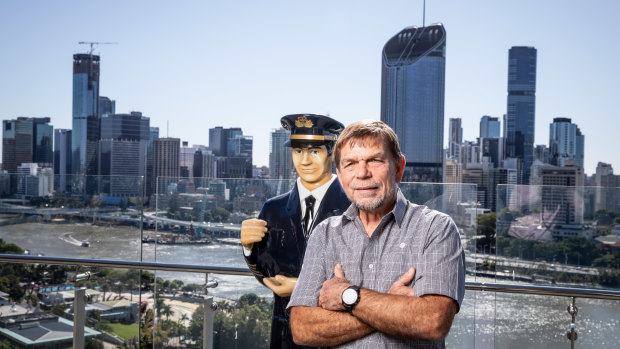 Flight Centre CEO Graham Turner with one of their "captains" that greet visitors to their stores. 