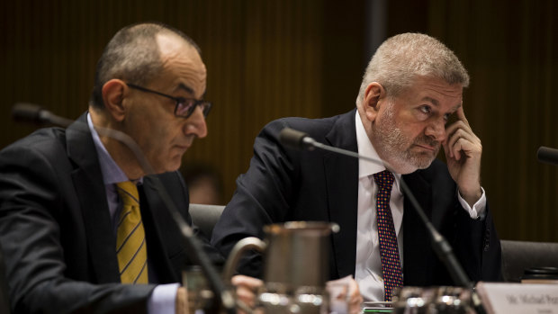 Secretary of the Department of Home Affairs, Michael Pezzullo, and Senator Mitch Fifield during a Senate estimates hearing on Monday.