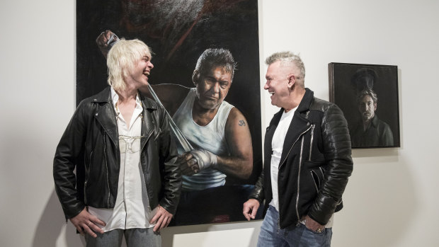 Painter Jamie Preisz stands with rock star Jimmy Barnes by his portrait  Jimmy (title fight).