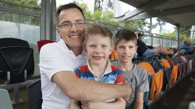 Stuart Richardson from Cook with his sons Darcy, 6, and Hugo, 9, enjoying day four of the Test match between Australia and Sri Lanka.
