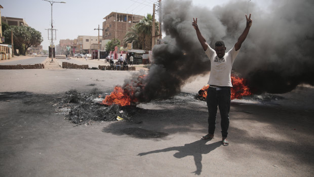 People burn tires during a protest a day after the military seized power Khartoum, Sudan.