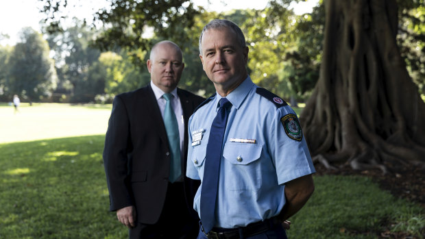 Hand over: NSW Police Assistant Commissioner Mick Willing with the new Commissioner of Resilience Shane Fitzsimmons. 