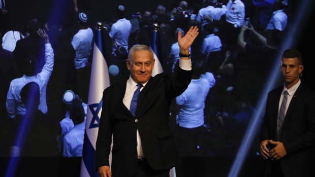 Israeli Prime Minister Benjamin Netanyahu addressees his supporters at party headquarters after elections in Tel Aviv in the early hours of Wednesday.